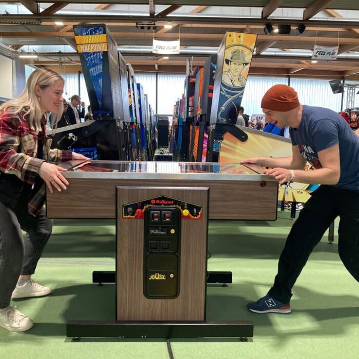 Visitors at EPC playing a 2-player pinball game.